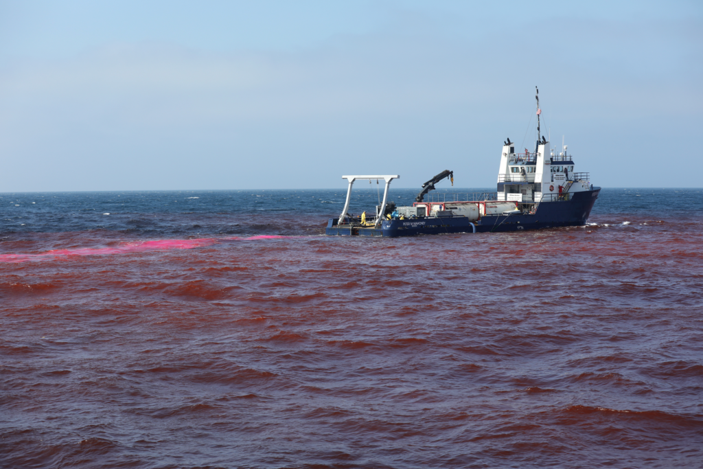 The research vessel Connecticut collects samples in a patch of alkalinity and tracer dye during the LOC-NESS Project. (Daniel Cojanu / Woods Hole Oceanographic Institution)